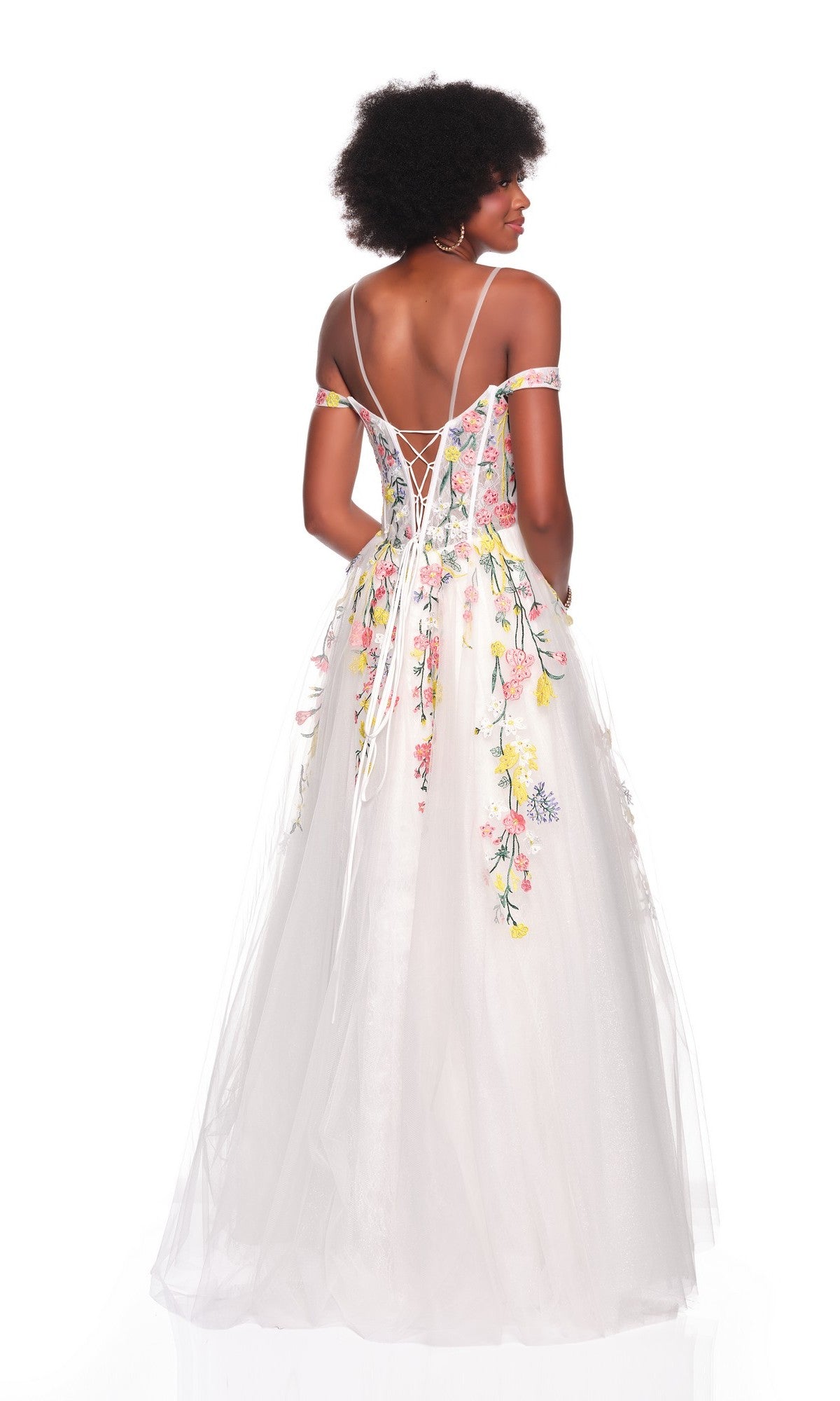A woman faces away, wearing the Dave and Johnny 12489 long prom dress—a white gown with floral embroidery, thin straps, off-shoulder sleeves, and a lace-up back.